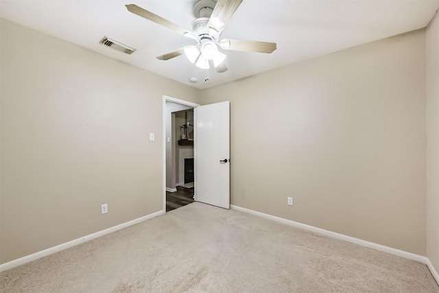 2322 Old Oak Ln, Kingwood, TX 77339 - unfurnished bedroom with carpet and a ceiling fan