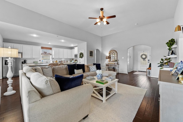 22402 Threefold Ridge Dr, Hockley, TX 77447 - living room with arched walkways, ceiling fan, dark wood-style floors, and recessed lighting