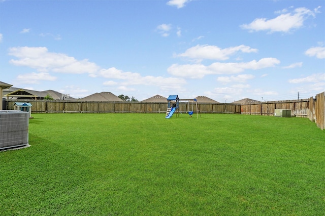22402 Threefold Ridge Dr, Hockley, TX 77447 - fenced backyard with a playground