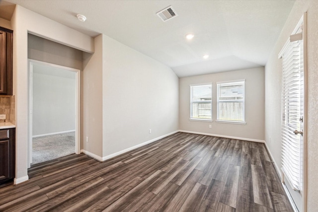 7222 Melrose Ln, Rosharon, TX 77583 - unfurnished living room with dark wood-style flooring, vaulted ceiling, and recessed lighting