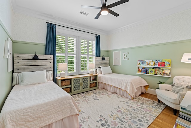 1603 Columbia St, Houston, TX 77008 - bedroom featuring wood finished floors, crown molding, and a ceiling fan
