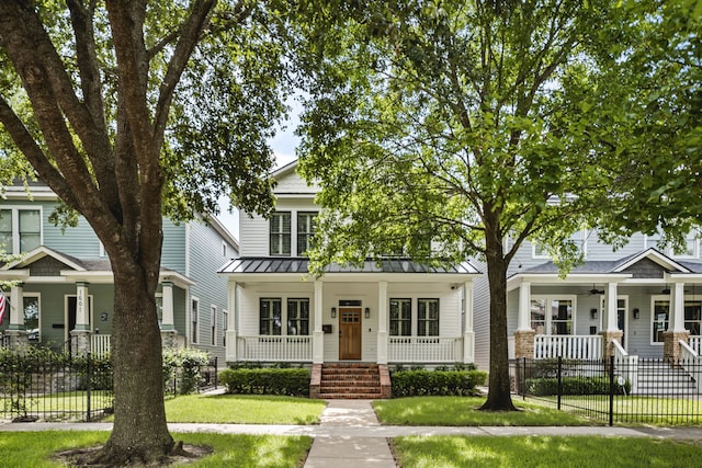 1603 Columbia St, Houston, TX 77008 - view of front of property with covered porch, a ceiling fan, and a fenced front yard