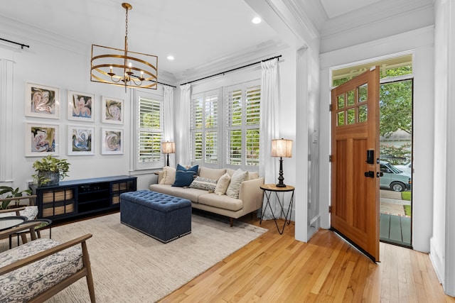 1603 Columbia St, Houston, TX 77008 - living room featuring ornamental molding, light wood finished floors, a chandelier, healthy amount of natural light, and recessed lighting