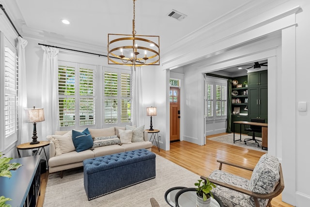 1603 Columbia St, Houston, TX 77008 - living room with ornamental molding, a chandelier, light wood-style flooring, a desk, and recessed lighting