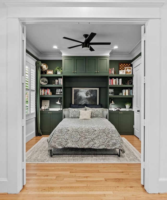 1603 Columbia St, Houston, TX 77008 - bedroom with crown molding, a fireplace, light wood-type flooring, recessed lighting, and ceiling fan