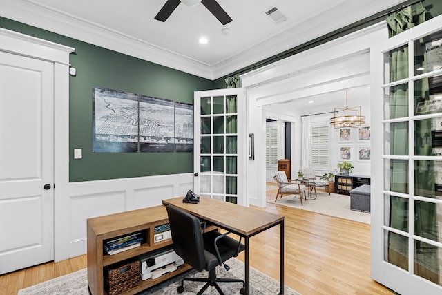 1603 Columbia St, Houston, TX 77008 - home office with ornamental molding, wood finished floors, a chandelier, a ceiling fan, and a decorative wall