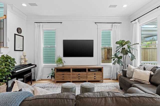 1603 Columbia St, Houston, TX 77008 - living area featuring wood finished floors, ornamental molding, and recessed lighting