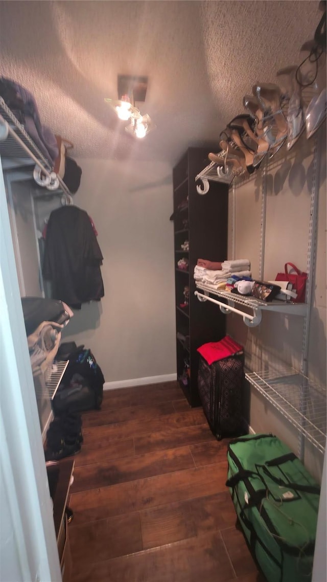 2818 S Bartell Dr Unit 13, Houston, TX 77054 - spacious closet with dark wood-style flooring