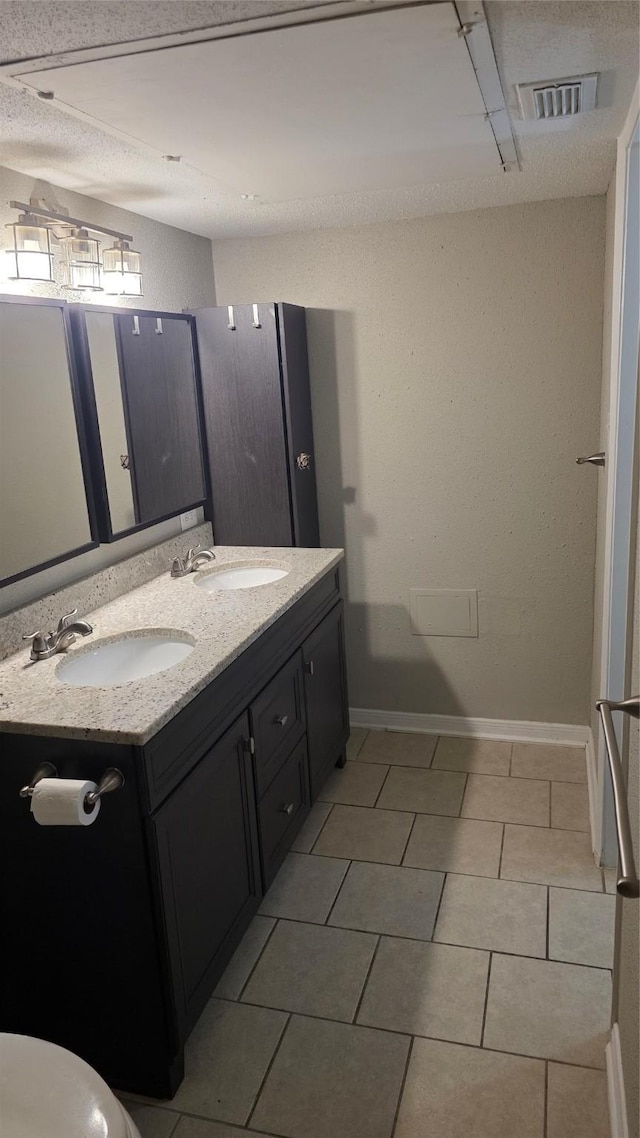 2818 S Bartell Dr Unit 13, Houston, TX 77054 - full bathroom with double vanity and tile patterned floors