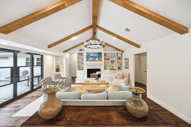 7730 Skyline Dr, Houston, TX 77063 - living room featuring dark wood-style flooring, a fireplace with raised hearth, french doors, recessed lighting, and built in features