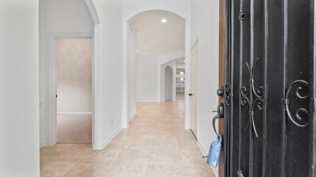 4627 Western Brook Dr, Spring, TX 77388 - foyer featuring arched walkways, light tile patterned floors, and recessed lighting