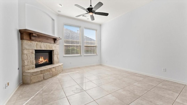 4627 Western Brook Dr, Spring, TX 77388 - unfurnished living room featuring a fireplace, crown molding, ceiling fan, and light tile patterned flooring