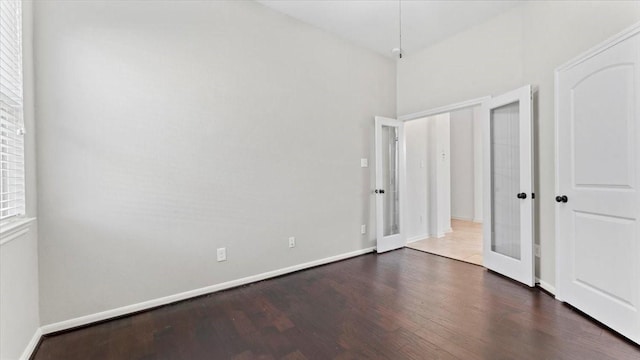 4627 Western Brook Dr, Spring, TX 77388 - unfurnished bedroom with dark wood finished floors and french doors