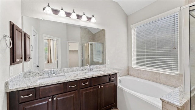 4627 Western Brook Dr, Spring, TX 77388 - full bathroom featuring a garden tub, a shower stall, double vanity, and lofted ceiling