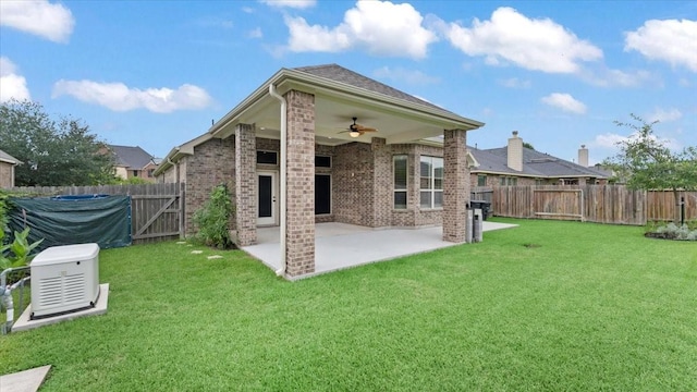 4627 Western Brook Dr, Spring, TX 77388 - rear view of house featuring ceiling fan, brick siding, a patio area, and a fenced backyard