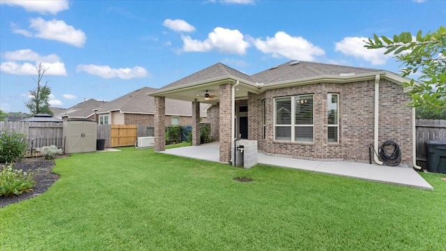 4627 Western Brook Dr, Spring, TX 77388 - rear view of house featuring a ceiling fan, a patio, a fenced backyard, a storage shed, and brick siding