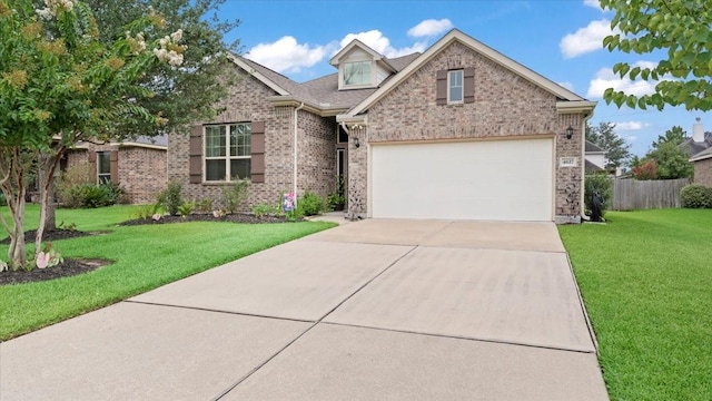 4627 Western Brook Dr, Spring, TX 77388 - view of front of house with brick siding, concrete driveway, and a garage