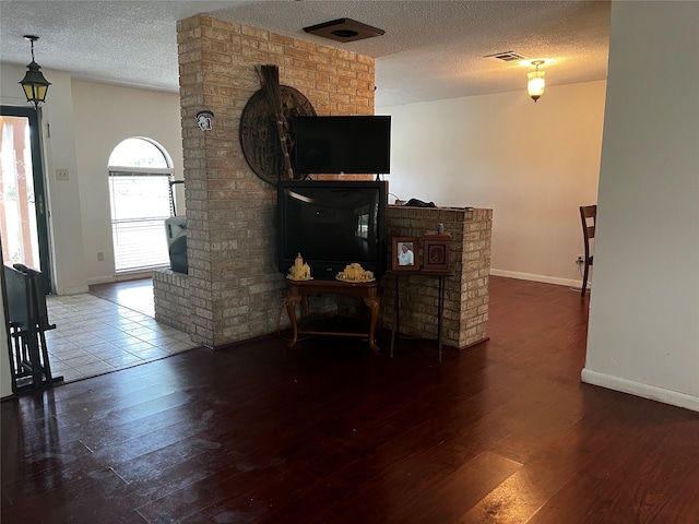 10005 Cypress N Houston Rd, Houston, TX 77070 - living area featuring hardwood / wood-style flooring and a textured ceiling