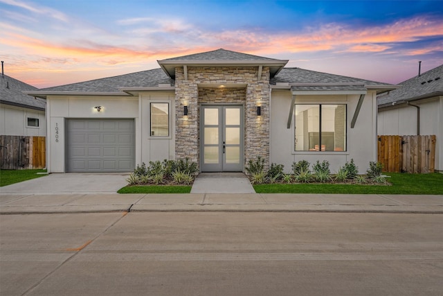 10406 Grove Row Ave, Richmond, TX 77407 - view of front of house with a garage, stucco siding, driveway, and stone siding