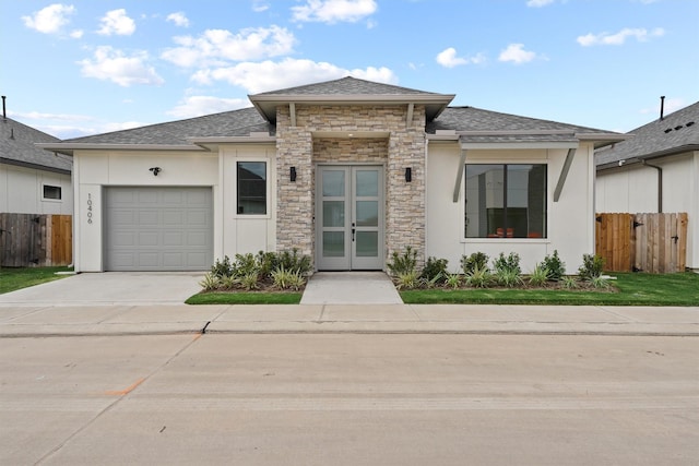 10406 Grove Row Ave, Richmond, TX 77407 - view of front of property featuring french doors, stucco siding, concrete driveway, and an attached garage