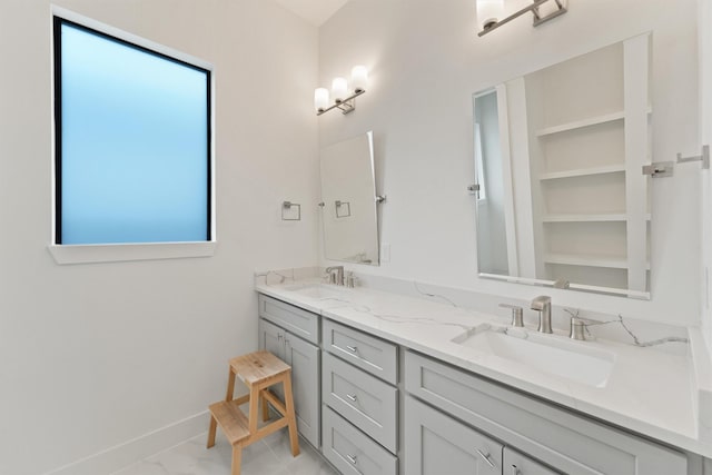 10406 Grove Row Ave, Richmond, TX 77407 - bathroom featuring double vanity and baseboards