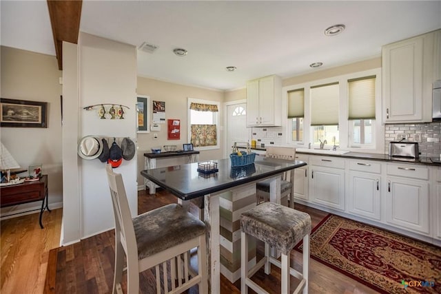 40 Sailfish Lndg, Port Lavaca, TX 77979 - kitchen with tasteful backsplash, healthy amount of natural light, and dark wood-type flooring