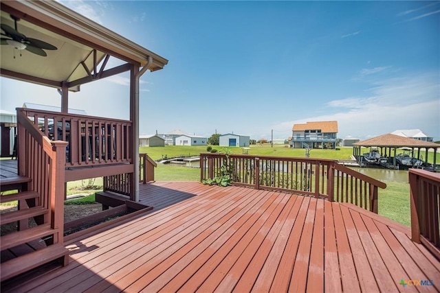 40 Sailfish Lndg, Port Lavaca, TX 77979 - wooden terrace with ceiling fan, a yard, a residential view, and a water view