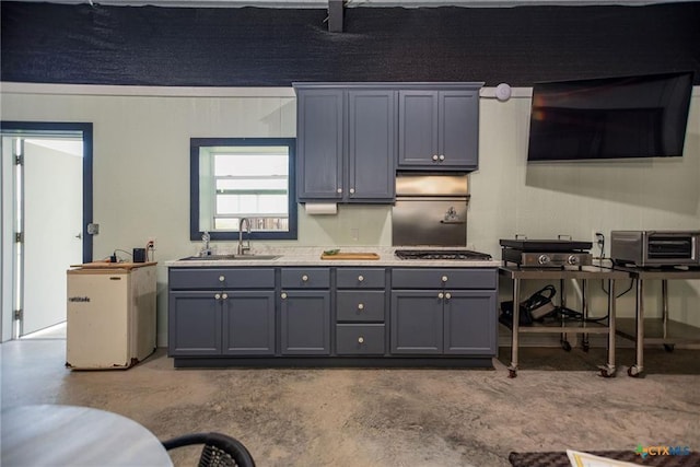 40 Sailfish Lndg, Port Lavaca, TX 77979 - kitchen with gray cabinets, concrete flooring, light countertops, and stainless steel gas cooktop
