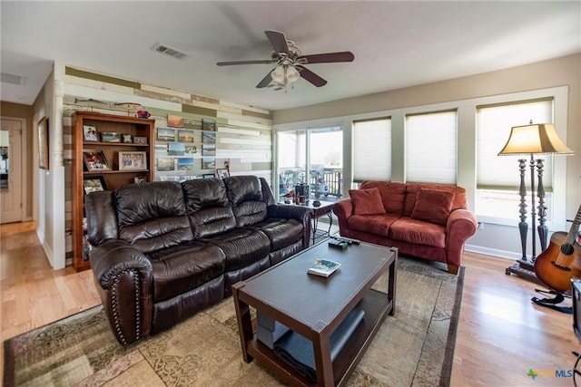 40 Sailfish Lndg, Port Lavaca, TX 77979 - living area featuring light wood-type flooring, a ceiling fan, and plenty of natural light