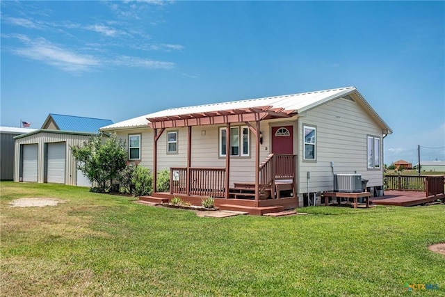 40 Sailfish Lndg, Port Lavaca, TX 77979 - rear view of property with a deck, a pergola, a lawn, and a metal roof