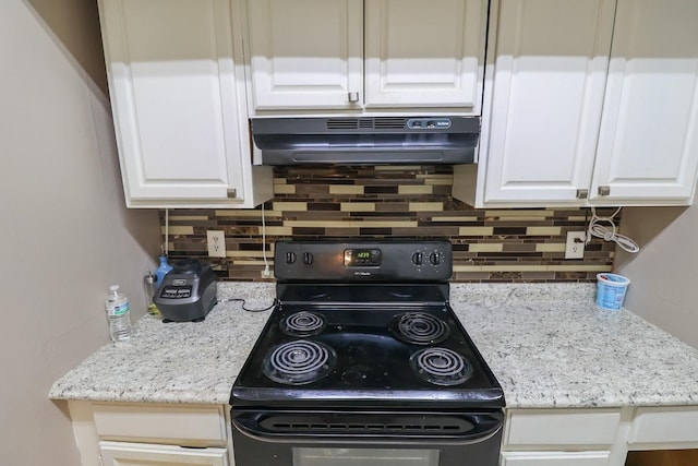 7264 Regency Square Ct, Houston, TX 77036 - kitchen featuring black / electric stove, under cabinet range hood, backsplash, and white cabinetry