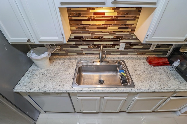 7264 Regency Square Ct, Houston, TX 77036 - kitchen view of backsplash and white cabinets