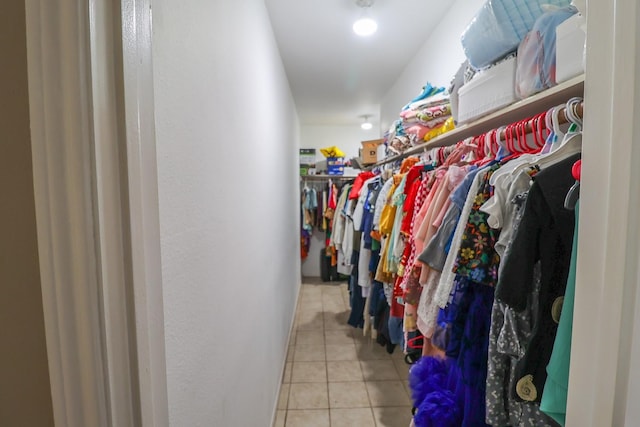 7264 Regency Square Ct, Houston, TX 77036 - walk in closet with tile patterned floors