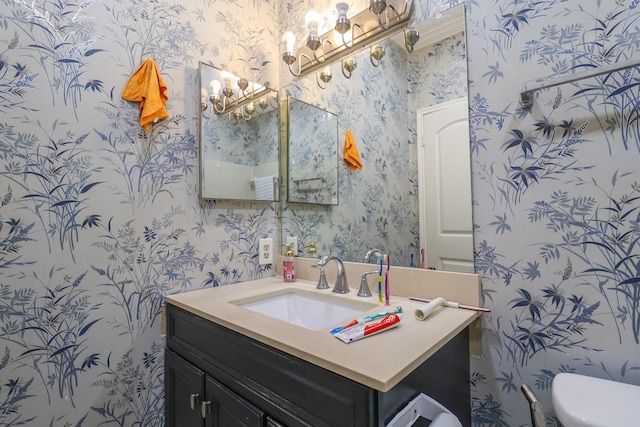 7264 Regency Square Ct, Houston, TX 77036 - half bath with wallpapered walls, vanity, and a chandelier