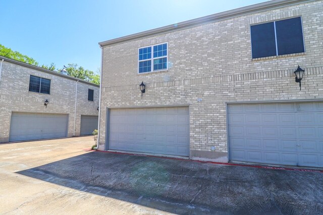 7264 Regency Square Ct, Houston, TX 77036 - view of front of home featuring brick siding and a garage