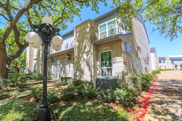 7264 Regency Square Ct, Houston, TX 77036 - view of side of property featuring a central air condition unit