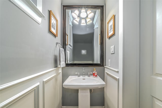 326 W 24th St, Houston, TX 77008 - bathroom with a chandelier and a sink