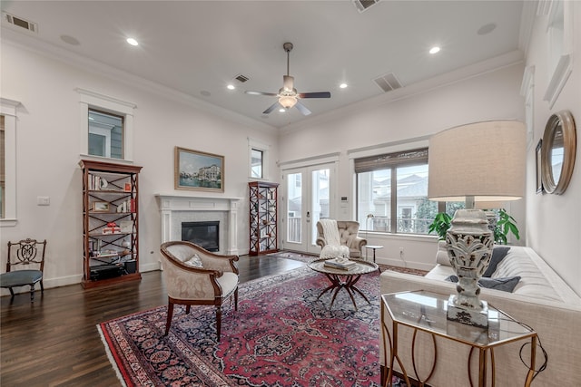 326 W 24th St, Houston, TX 77008 - living area featuring a glass covered fireplace, dark wood-type flooring, ceiling fan, recessed lighting, and ornamental molding