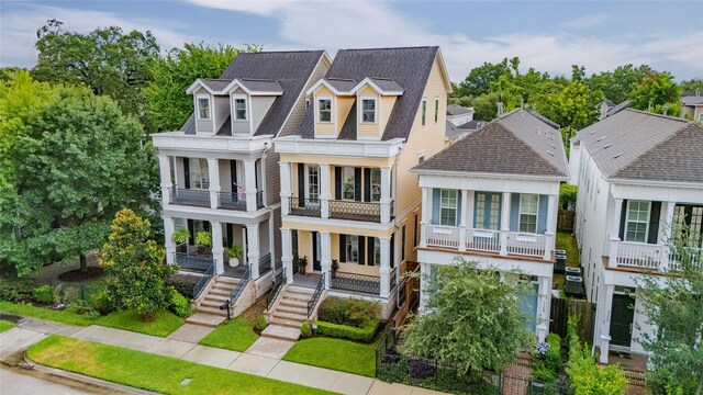 326 W 24th St, Houston, TX 77008 - view of front of property with a balcony, a porch, and roof with shingles