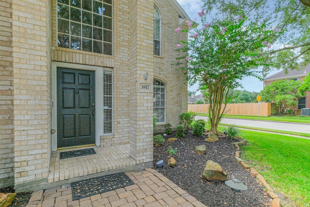 3817 Dunlavy Dr, Pearland, TX 77581 - doorway to property featuring brick siding
