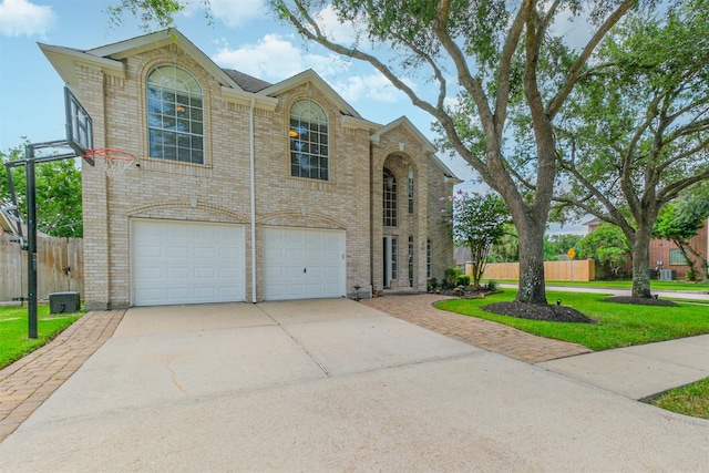 3817 Dunlavy Dr, Pearland, TX 77581 - traditional-style house featuring brick siding, driveway, and a garage