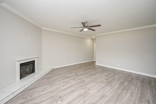 9707 Richmond Ave Unit 3, Houston, TX 77042 - unfurnished living room with ceiling fan, wood finished floors, crown molding, and a tiled fireplace
