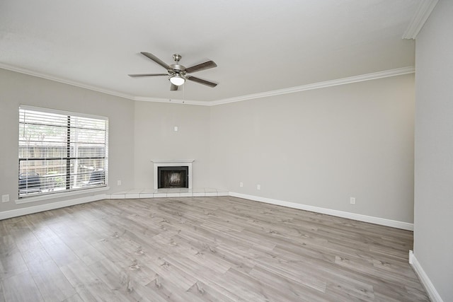 9707 Richmond Ave Unit 3, Houston, TX 77042 - unfurnished living room featuring ornamental molding, ceiling fan, light wood-type flooring, and a fireplace with raised hearth