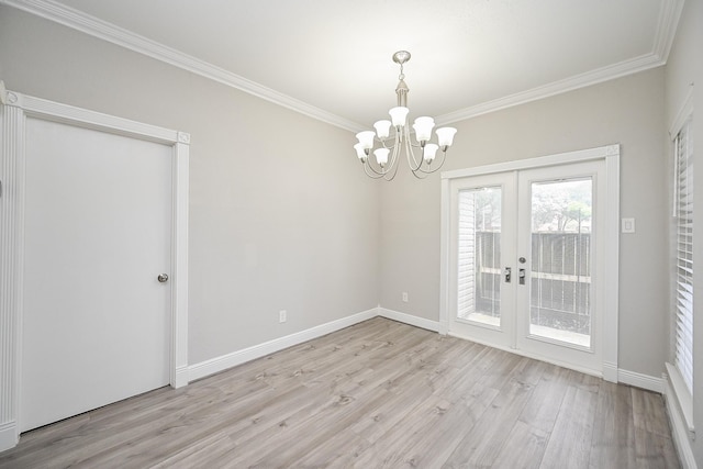 9707 Richmond Ave Unit 3, Houston, TX 77042 - spare room with french doors, light wood-style floors, crown molding, and a chandelier