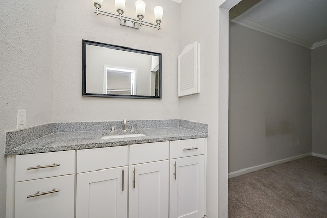 9707 Richmond Ave Unit 3, Houston, TX 77042 - bathroom featuring crown molding and vanity