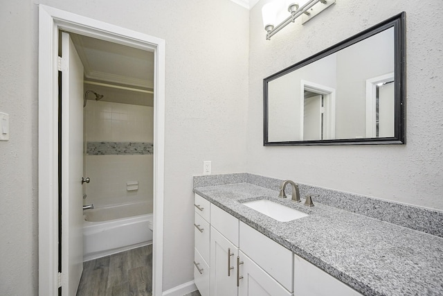 9707 Richmond Ave Unit 3, Houston, TX 77042 - bathroom with vanity, wood finished floors, and bathing tub / shower combination