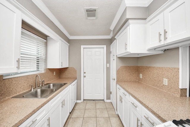 3938 Danpree St, Pasadena, TX 77504 - kitchen featuring dishwasher, white cabinets, backsplash, light countertops, and ornamental molding