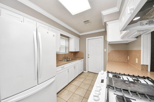 3938 Danpree St, Pasadena, TX 77504 - kitchen featuring white appliances, ventilation hood, backsplash, white cabinets, and crown molding