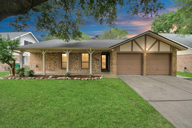 3938 Danpree St, Pasadena, TX 77504 - ranch-style house with an attached garage, concrete driveway, a lawn, and a porch