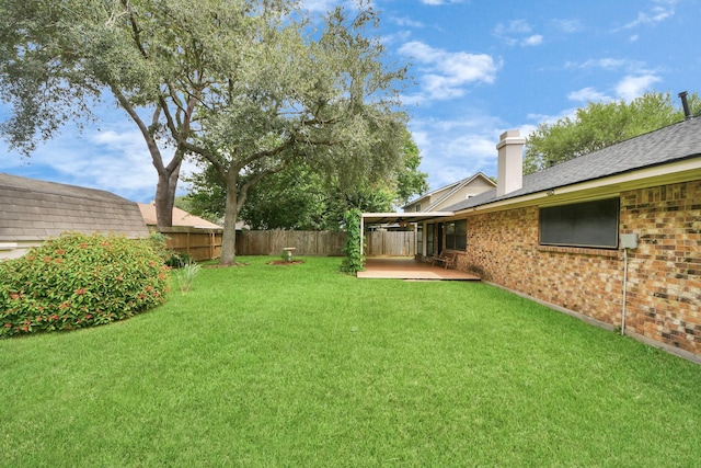 3938 Danpree St, Pasadena, TX 77504 - fenced backyard with a patio area